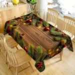 Kersttafelkleed met houtlookprint en dennentakken op een eettafel met houten stoelen